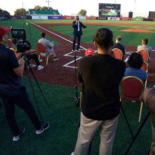 Baseball United CEO and co-founder Kash Shaikh speaks to journalists ahead of the league's inaugural season at the new Barry Larkin Field in Ud al-Bayda outside of Dubai, United Arab Emirates, Thursday, Nov. 13, 2025. (AP Photo/Fatima Shbair)