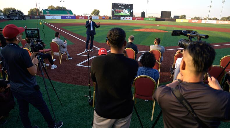 Baseball United CEO and co-founder Kash Shaikh speaks to journalists ahead of the league's inaugural season at the new Barry Larkin Field in Ud al-Bayda outside of Dubai, United Arab Emirates, Thursday, Nov. 13, 2025. (AP Photo/Fatima Shbair)