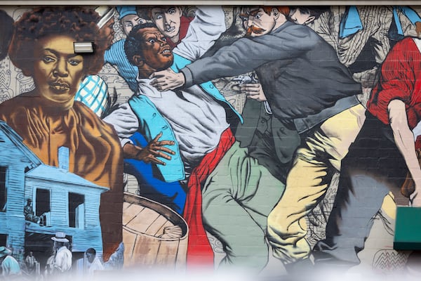 A view of a controversial mural painted by artist Fabian Williams at Focused Community Strategies in Atlanta on Tuesday, December 2, 2025. (Arvin Temkar/AJC)