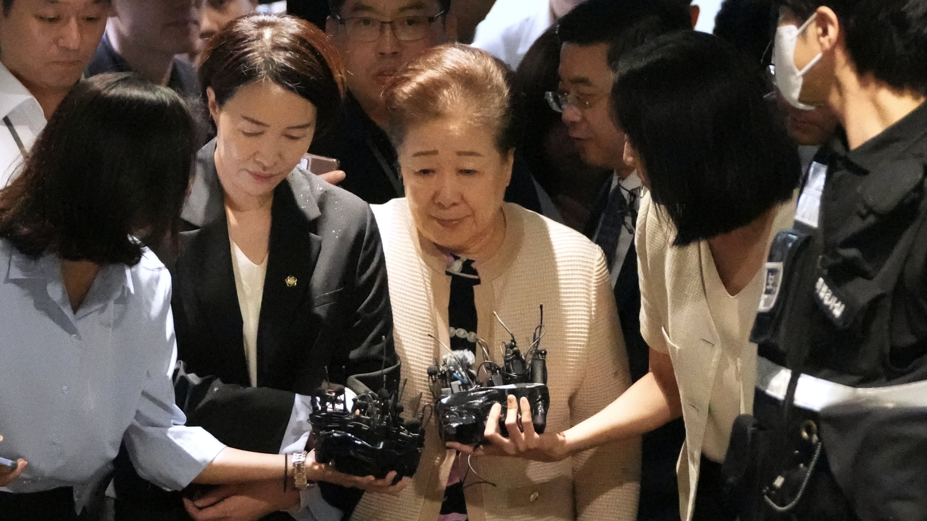 Hak Ja Han, center, the leader of South Korea's Unification Church, arrives at a special prosecutor's office in Seoul, South Korea, Wednesday, Sept. 17, 2025. (AP Photo/Lee Jin-man)