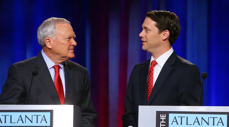 Republican Gov. Nathan Deal and  gubernatorial challenger Democrat Sen. Jason Carter pause to chat  after squaring off for their second debate during Oct. 19. The debate, sponsored by the Atlanta Press Club, was a part of the Loudermilk-Young Debate Series and was held at Georgia Public Broadcasting.