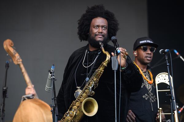 In this file photo, Kamasi Washington performs on the Pyramid Stage on day five of Glastonbury Festival at Worthy Farm, Pilton in June 2019 in Glastonbury, England. Dinner Party, a new supergroup of bicoastal jazz and hip-hop luminaries: L.A.'s Kamasi Washington and Terrace Martin, New York's Robert Glasper and North Carolina producer 9th Wonder (Patrick Douthit), released "Freeze Tag" in late June. (Leon Neal/Getty Images/TNS)