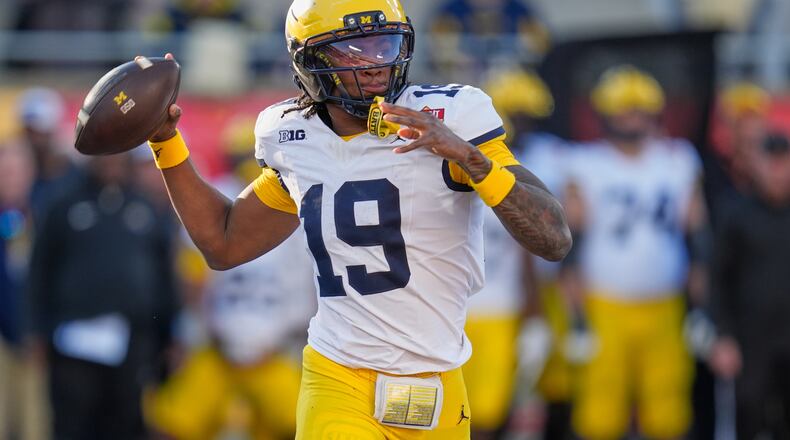 Michigan quarterback Bryce Underwood (19) throws a pass during the first half of the Citrus Bowl NCAA college football game, Wednesday, Dec. 31, 2025, in Orlando, Fla. (AP Photo/John Raoux)