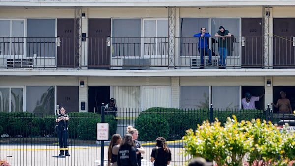 Multiple police agencies responded to the scene where two officers were injured and a suspect was killed in a shootout on Fulton Industrial Boulevard on Friday. (Ben Hendren for the Atlanta Journal-Constitution)