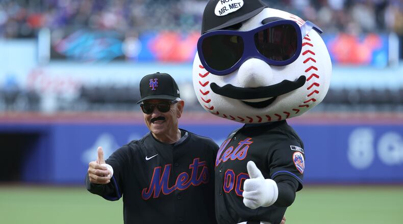 Former New York Mets manager Bobby Valentine, left, poses with Mr. Met after throwing out a ceremonial first pitch before a baseball game between the Mets and the Miami Marlins, Friday, May 29, 2026, in New York. (AP Photo/Pamela Smith)