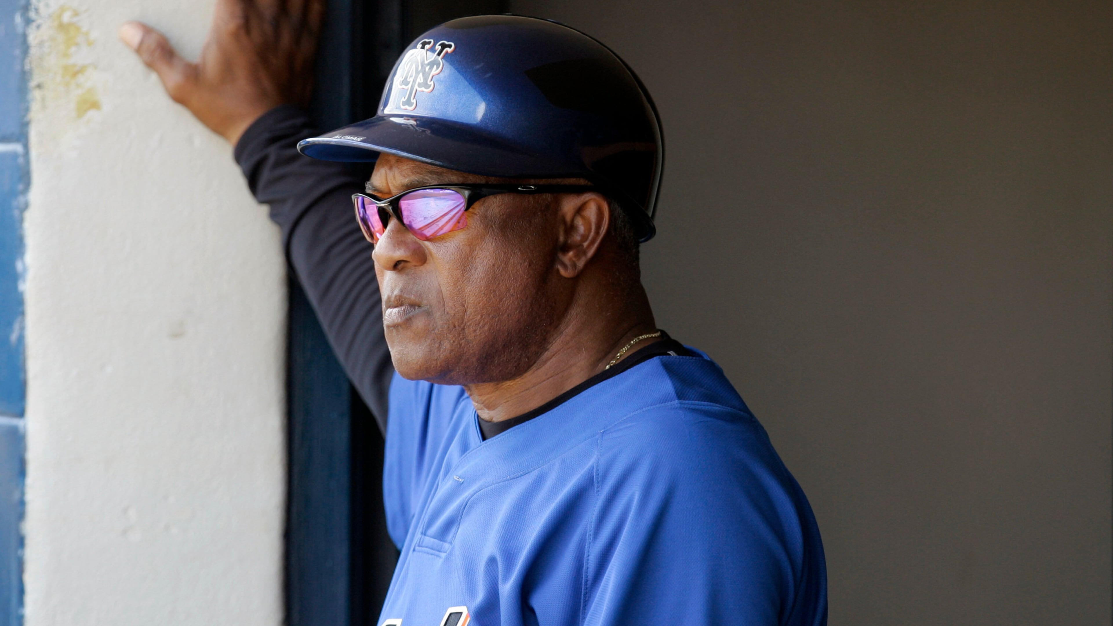 FILE - New York Mets coach Sandy Alomar Sr. watches from the dugout as the Mets play the Cleveland Indians in a spring training baseball game, March 7, 2008, in Winter Haven, Fla. (AP Photo/Tony Dejak, File)