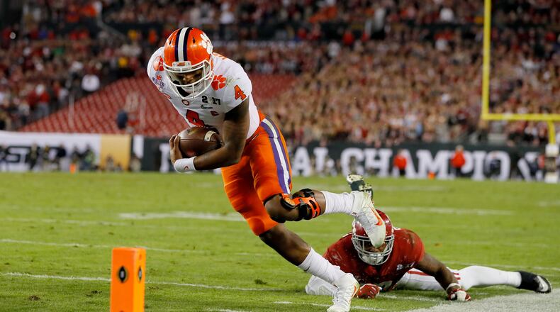 Quarterback Deshaun Watson finishes off an 8-yard touchdown run during the second quarter against the Alabama in Monday’s national championship game. (Kevin C. Cox/Getty Images)