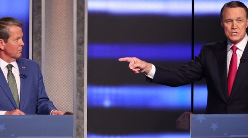 The race between Gov. Brian Kemp, left, and former U.S. Sen. David Perdue is the biggest battle on Tuesday's primary ballot. Miguel Martinez /miguel.martinezjimenez@ajc.com