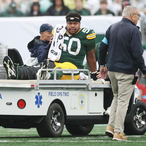Green Bay Packers guard Zach Bako-Bewele (50) is taken off the field following an injury during an NFL football game against the New York Jets in East Rutherford, N.J., Sunday, Sept. 20, 2026. (AP Photo/Adam Hunger)