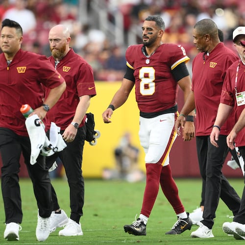 Washington Commanders quarterback Marcus Mariota (8) walks off the field during the first half of an NFL preseason football game against the Miami Dolphins, Friday, Aug. 14, 2026, in Landover, MD. (AP Photo/Nick Wass)