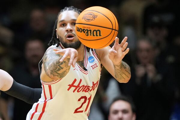 Houston's Emanuel Sharp passes during the first half in the Sweet 16 of the NCAA college basketball tournament against Purdue Friday, March 28, 2025, in Indianapolis. (AP Photo/AJ Mast)