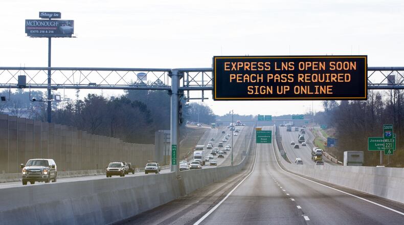 A sign is displayed informing drivers of the new reversible lanes on I-75, Thursday, Jan. 19, 2017, in McDonough, Ga. BRANDEN CAMP/SPECIAL