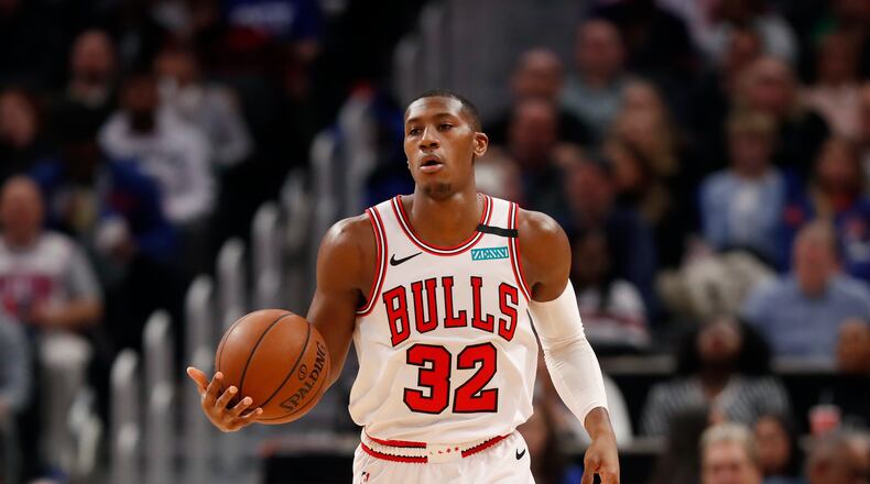 Chicago Bulls guard Kris Dunn brings the ball up court during the second half of an NBA basketball game, Saturday, Jan. 11, 2020, in Detroit. (AP Photo/Carlos Osorio)