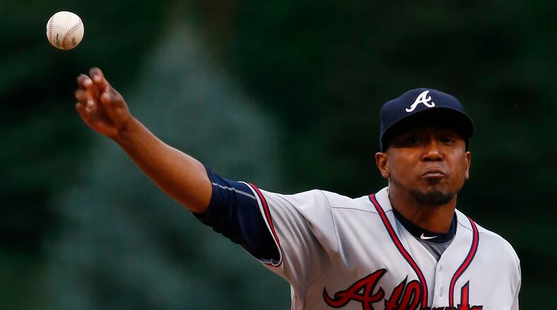 Braves starter Julio Teheran throws to the plate during the first inning of Monday's game in Denver.