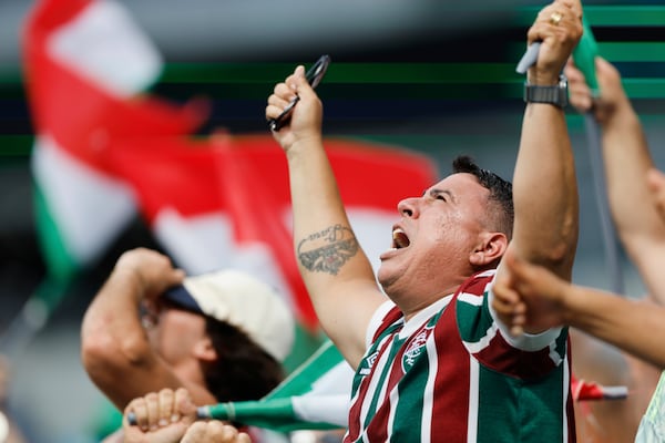 Fluminense fans celebrate after Hercules scored their second goal during the Club World Cup round of 16 soccer match between Inter Milan and Fluminense in Charlotte, N.C., Monday, June 30, 2025. (AP Photo/Nell Redmond)