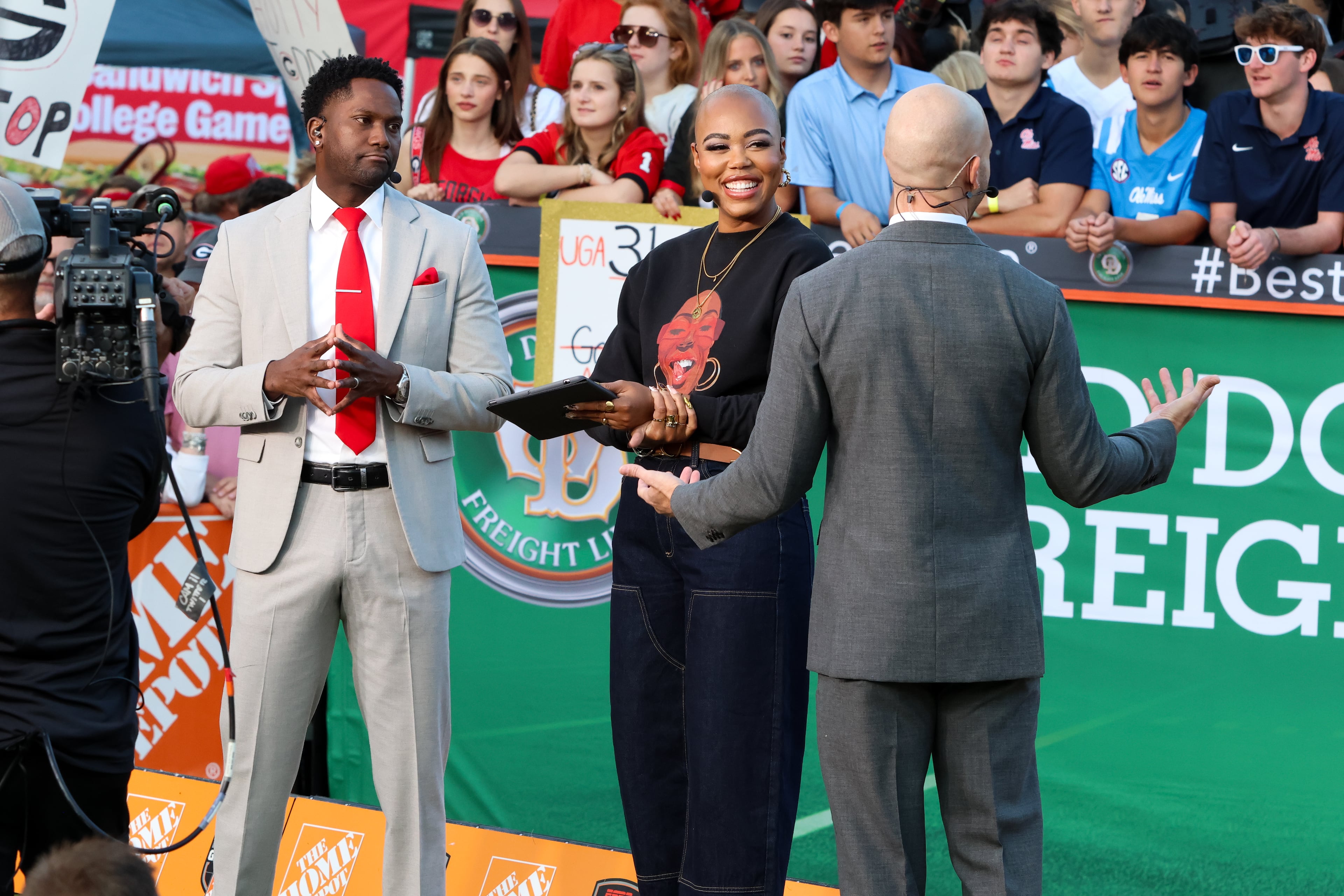 From left, Harry Douglas, Christine Williamson, and Harry Lyles Jr. co-host Countdown to GameDay before the ESPN College GameDay broadcast from Myers Quad at UGA on Saturday, October 18, 2025. (C.J. Bartunek for the AJC)