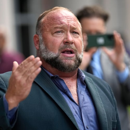 FILE - Right-wing conspiracy theorist Alex Jones speaks to the media after arriving at the federal courthouse for a hearing in front of a bankruptcy judge in Houston, June 14, 2024. (AP Photo/David J. Phillip, File)