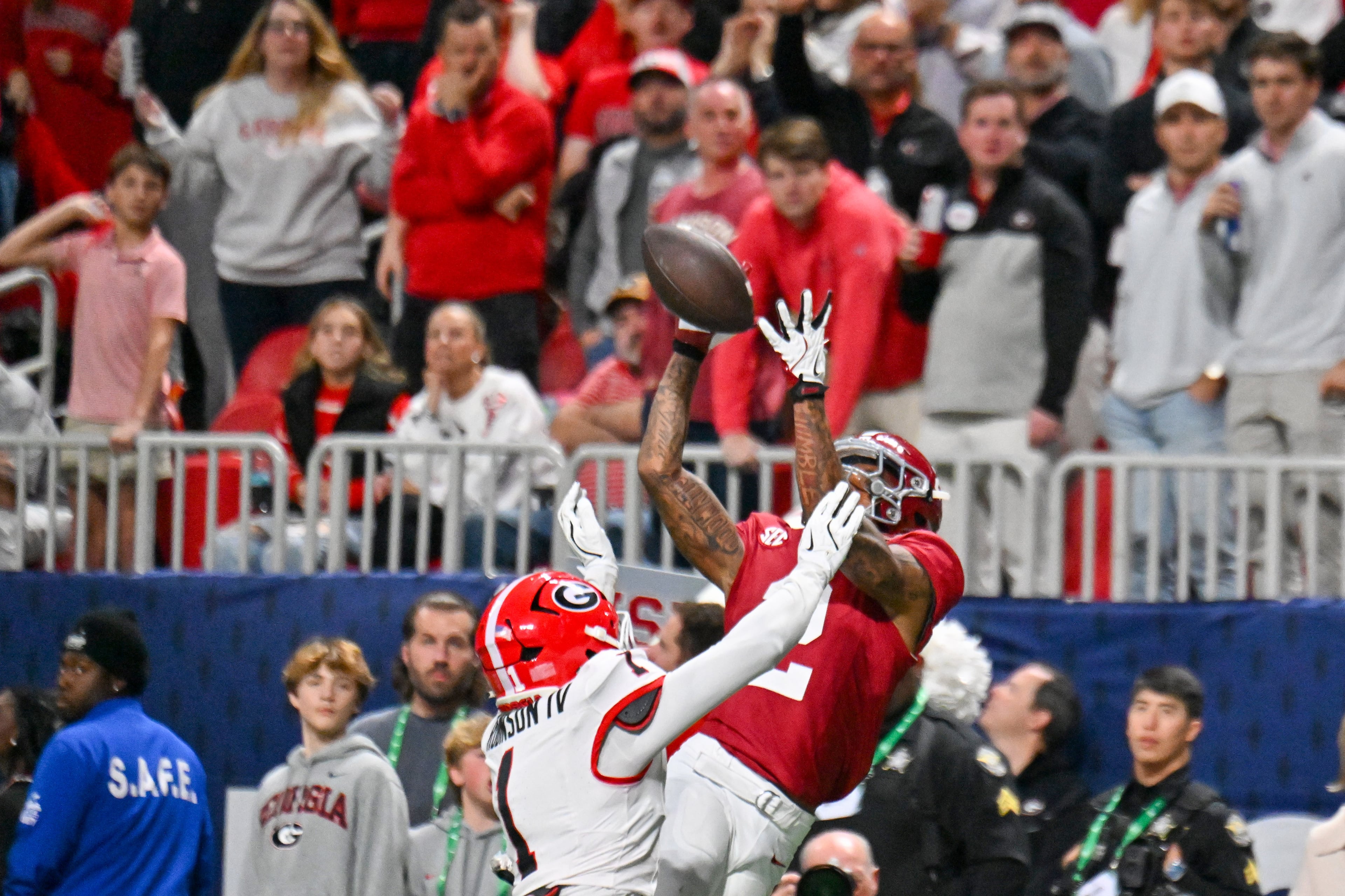 Alabama wide receiver Ryan Williams (2) is unable to catch an intended touchdown pass under pressure from Georgia defensive back Ellis Robinson IV (1) during the fourth quarter of the SEC Championship game at Mercedes-Benz Stadium, Saturday, Dec. 6, 2025, in Atlanta. (Hyosub Shin / AJC)