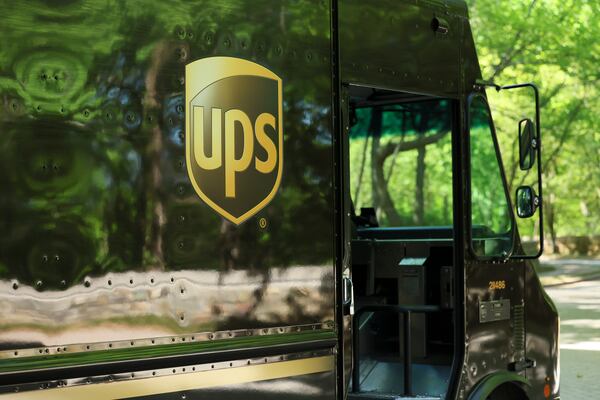 A UPS package truck sits at company headquarters. UPS says it will pass along all eligible tariff refunds to customers who paid them. (Jason Getz/AJC)