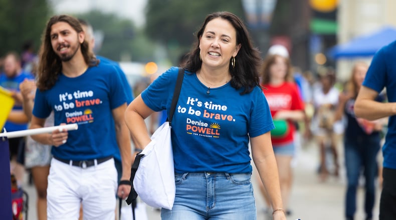Denise Powell, the Democratic candidate for the House of Representatives in Nebraska's second congressional district, walks with the Nebraska Democratic Party in a Juneteenth Parade in Omaha, Neb., Saturday, Aug. 15, 2026. (AP Photo/Rebecca S. Gratz)