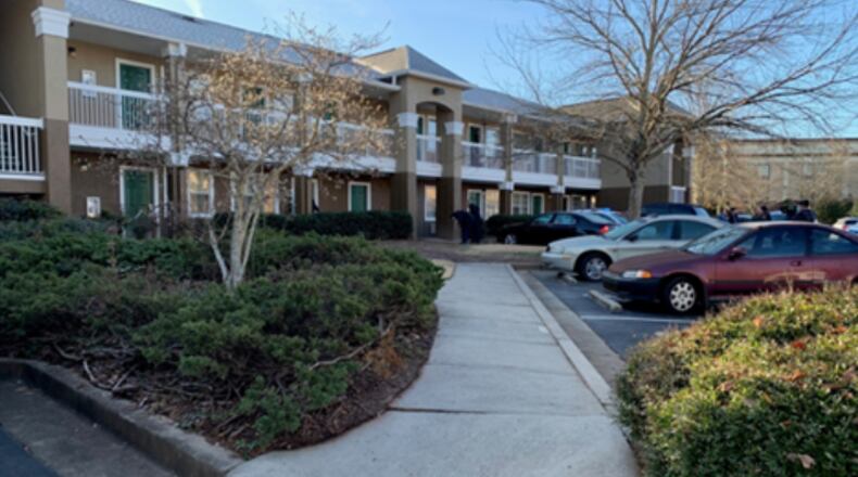 The man was found shot inside a hotel room in Gwinnett County.