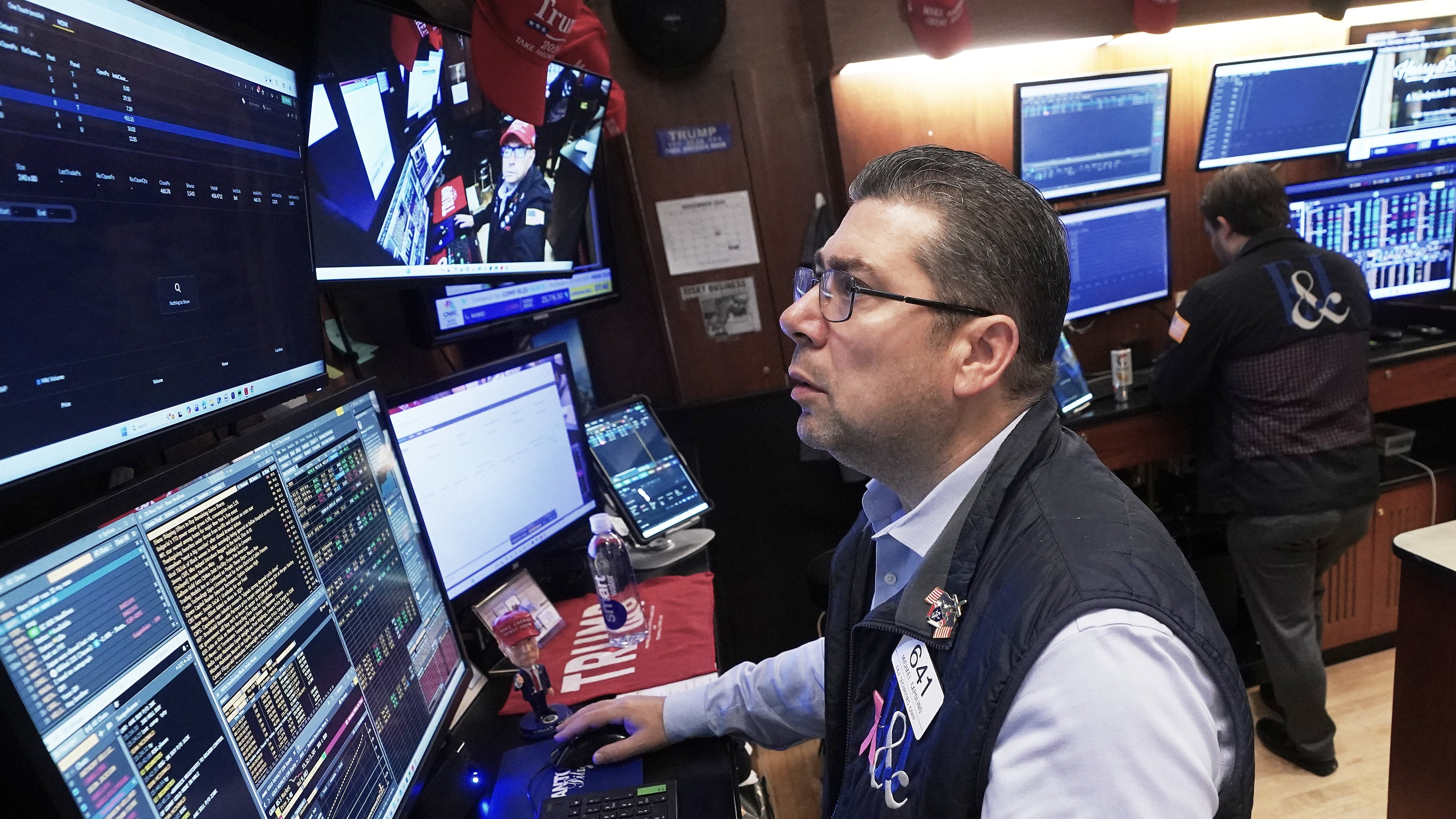 Trader Michael Capolino works on the floor of the New York Stock Exchange, Monday, Nov. 24, 2025. (AP Photo/Richard Drew)