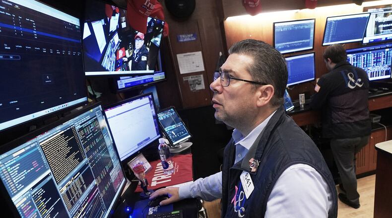 Trader Michael Capolino works on the floor of the New York Stock Exchange, Monday, Nov. 24, 2025. (AP Photo/Richard Drew)