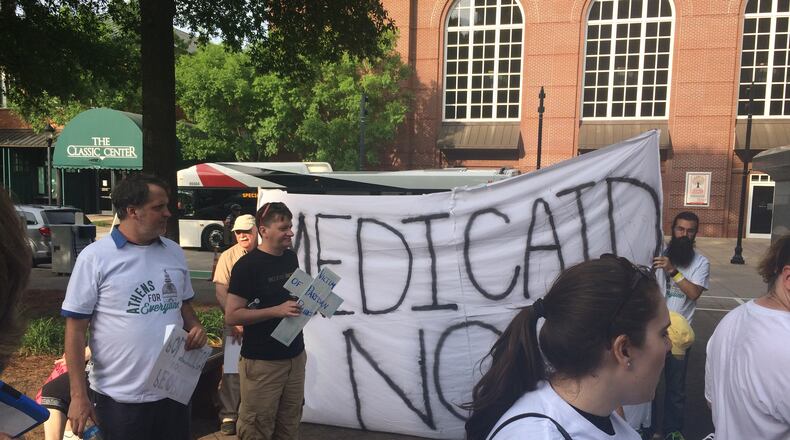 Supporters of Medicaid expansion rally outside the Georgia GOP convention