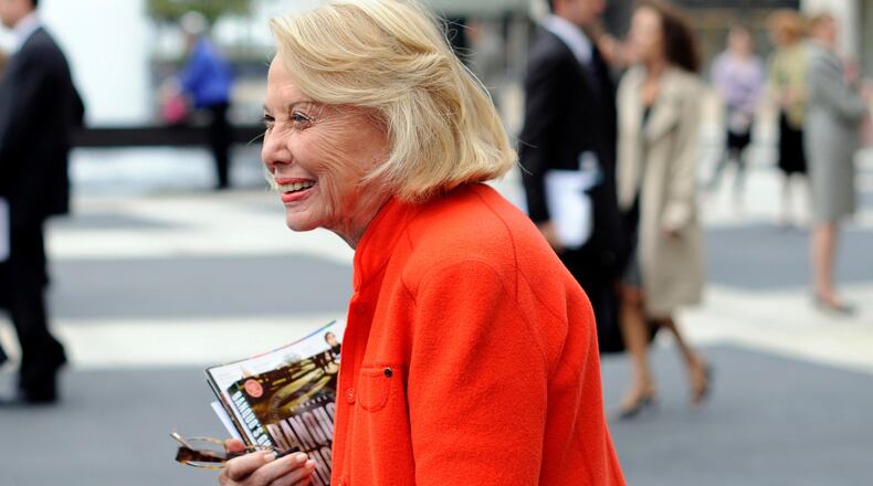 Gossip columnist and writer Liz Smith leaves an event in New York in August of 2009. Smith, a gossip columnist whose mixture of banter, barbs, and bon mots about the glitterati helped her climb the A-list as high as many of the celebrities she covered, has died. She was 94.