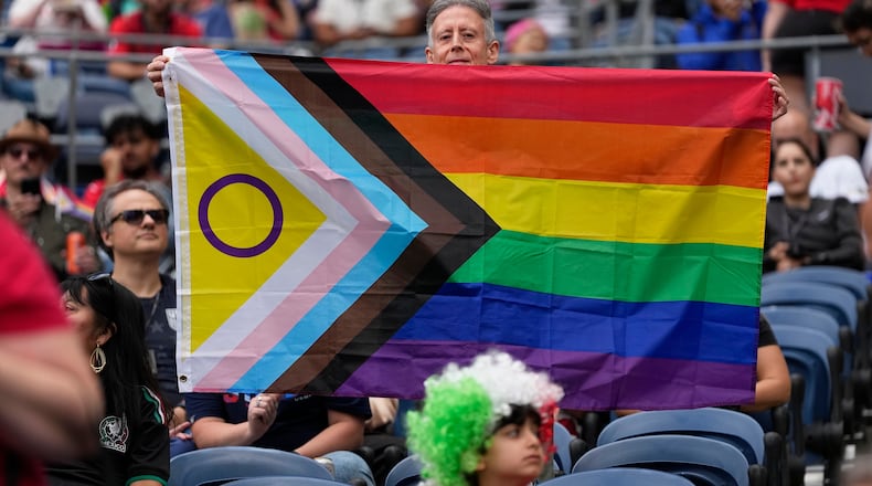 A spectator holds up a flag before the start of the World Cup Group G soccer match between Egypt and Iran in Seattle, Friday, June 26, 2026. (AP Photo//Lindsey Wasson)