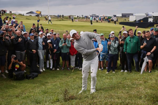 Rory McIlroy of Northern Ireland chips out of the rough on the 2nd hole during the first round of the British Open golf championship at the Royal Portrush Golf Club, Northern Ireland, Thursday, July 17, 2025. (AP Photo/Peter Morrison)