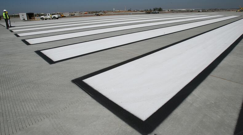 060322 - HAPEVILLE, GA -- These giant painted lines can be seen at the construction site on the fifth runway at Hartsfield Jackson Atlanta International Airport on Wednesday, March 22, 2006. (JOHNNY CRAWFORD/AJC staff)