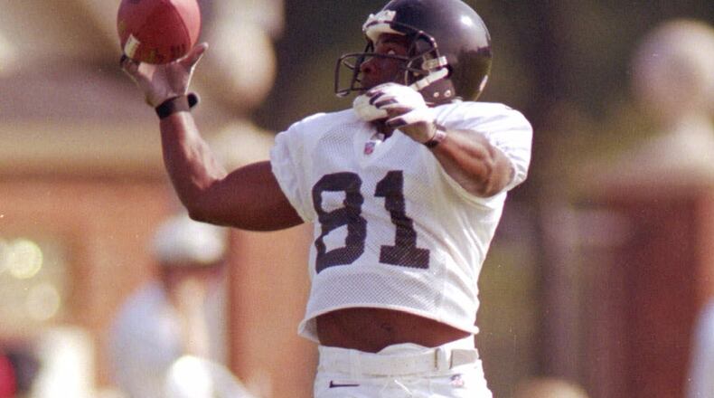 SPECIAL TO THE ATLANTA JOURNAL CONSTITUTION--Atlanta's terance Mathis makes a one handed grab during training camp at Furman University in Greenville, SC Tuesday August 3,1999.(Special to The Atlanta Journal Constitution by Patick Collard)