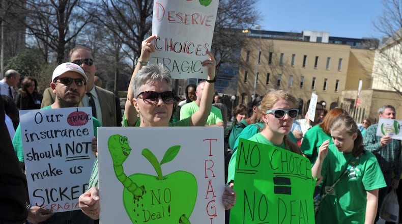 Supporters of T.R.A.G.I.C. (Teachers Rally to Advocate for Georgia Insurance Choices) protest outside the state Capitol earlier this year. (AJC Photo / Brant Sanderlin)