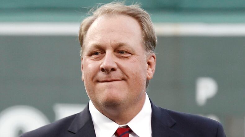 In this Aug. 3, 2012, file photo, former Boston Red Sox pitcher Curt Schilling looks on after being introduced as a new member of the Boston Red Sox Hall of Fame before a baseball game between the Red Sox and the Minnesota Twins at Fenway Park in Boston. Schilling is defending himself after making comments on social media about transgender people, saying he was expressing his opinion.