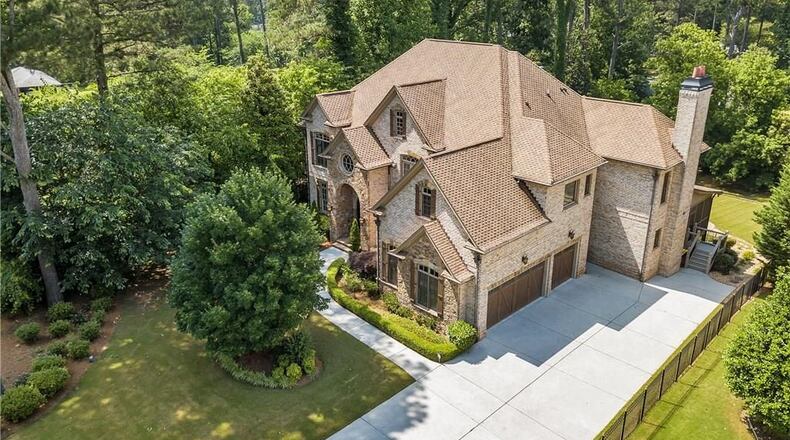 This Decatur home features a private elevator, massive backyard with a pool and spa and a home theatre room — all for a $1.2 million price tag.