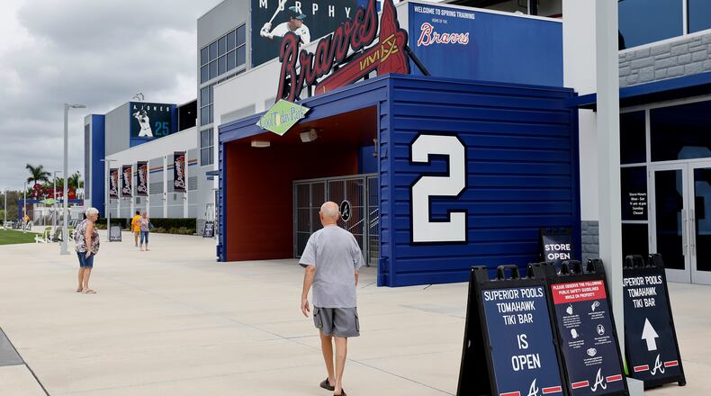 A few fans arrive to watch from the Tomahawk Tiki Bar at CoolToday Park in North Port, Fla., as the Braves play the Tampa Bay Rays in a minor-league game Thursday. (Curtis Compton / Curtis.Compton@ajc.com)