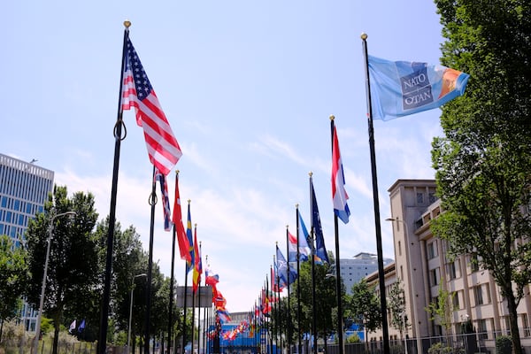 International flags on the venue ahead of the upcoming NATO summit in The Hague, Netherlands, Monday, June 23, 2025. (AP Photo/Patrick Post)