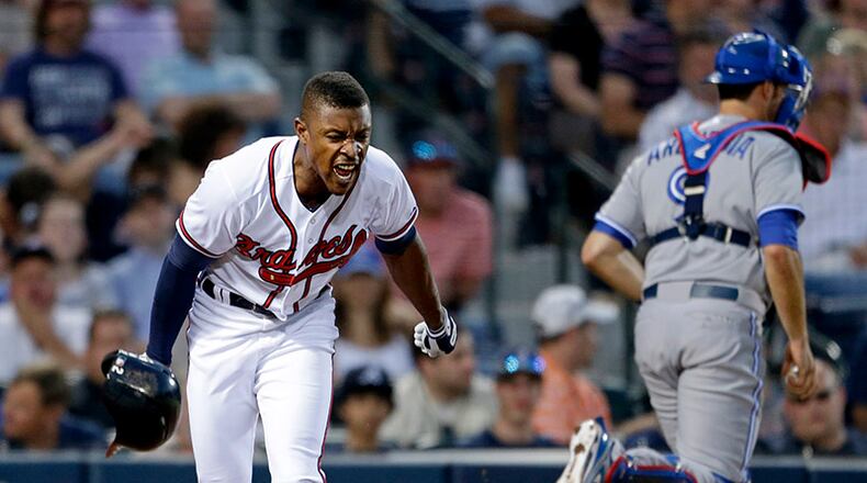 Braves outfielder B.J. Upton throws his helmet on the ground after striking out to end the fourth inning against the Toronto Blue Jays, Wednesday in Atlanta.