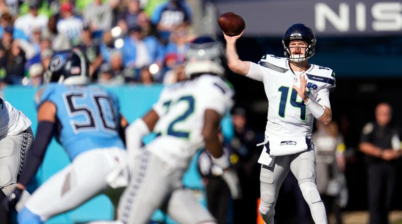 Seattle Seahawks quarterback Sam Darnold, who was with Minnesota last season, signed a three-year, $100.5 million contract with the Seahawks in free agency. (George Walker IV/AP)