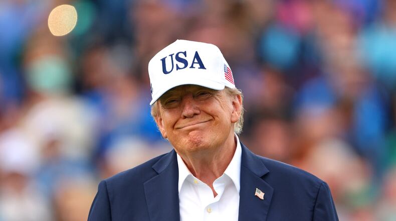 U.S. President Donald Trump smiles after the trophy presentation of the Irish Open at the Trump International Golf Links course in Doonbeg, Ireland, Sunday, Sept. 13, 2026.(AP Photo/Peter Morrison)