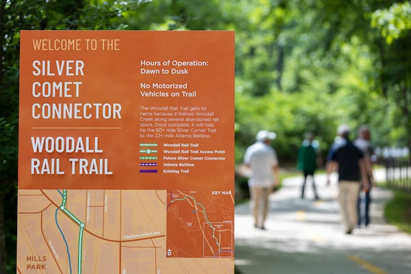 People walk along the trail at the grand opening at the Woodall Rail Trail in Atlanta on May 9, 2025. It’s the first completed segment of the Silver Comet connector in the city of Atlanta. (Arvin Temkar/AJC)
