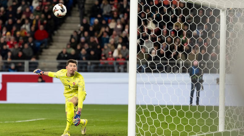 Switzerland's goalkeeper Gregor Kobel watches the ball go into the net for Germany's fourth goal during an international friendly soccer match between Switzerland and Germany in Basel, Switzerland, Friday, March 27, 2026. (Claudio Thoma/Keystone via AP)