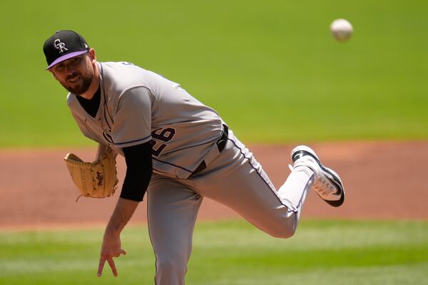 Colorado Rockies' Austin Gomber (26) delivers against Atlanta Braves' Ronald Acuña Jr., in the first inning of a baseball game, Sunday, June 15, 2025, in Atlanta. (AP Photo/Mike Stewart)