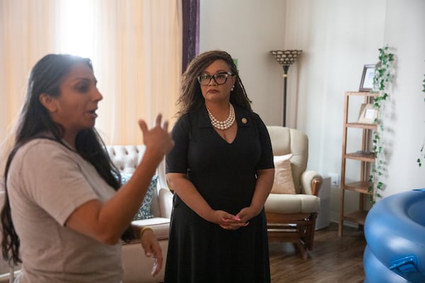 U.S. Rep. Nikema Williams takes a tour of the Atlanta Birth Center with Anjli Hinman, co-founder and facilitiy's midwife director, on  Friday. (Riley Bunch/AJC)