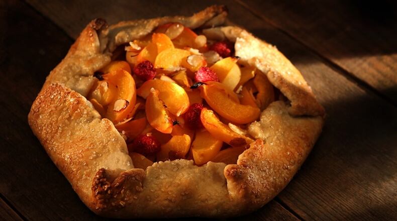 This Apricot Galette consists of a rolled edge crust with raspberries and shaved almonds. (Kirk McKoy/Los Angeles Times/TNS)