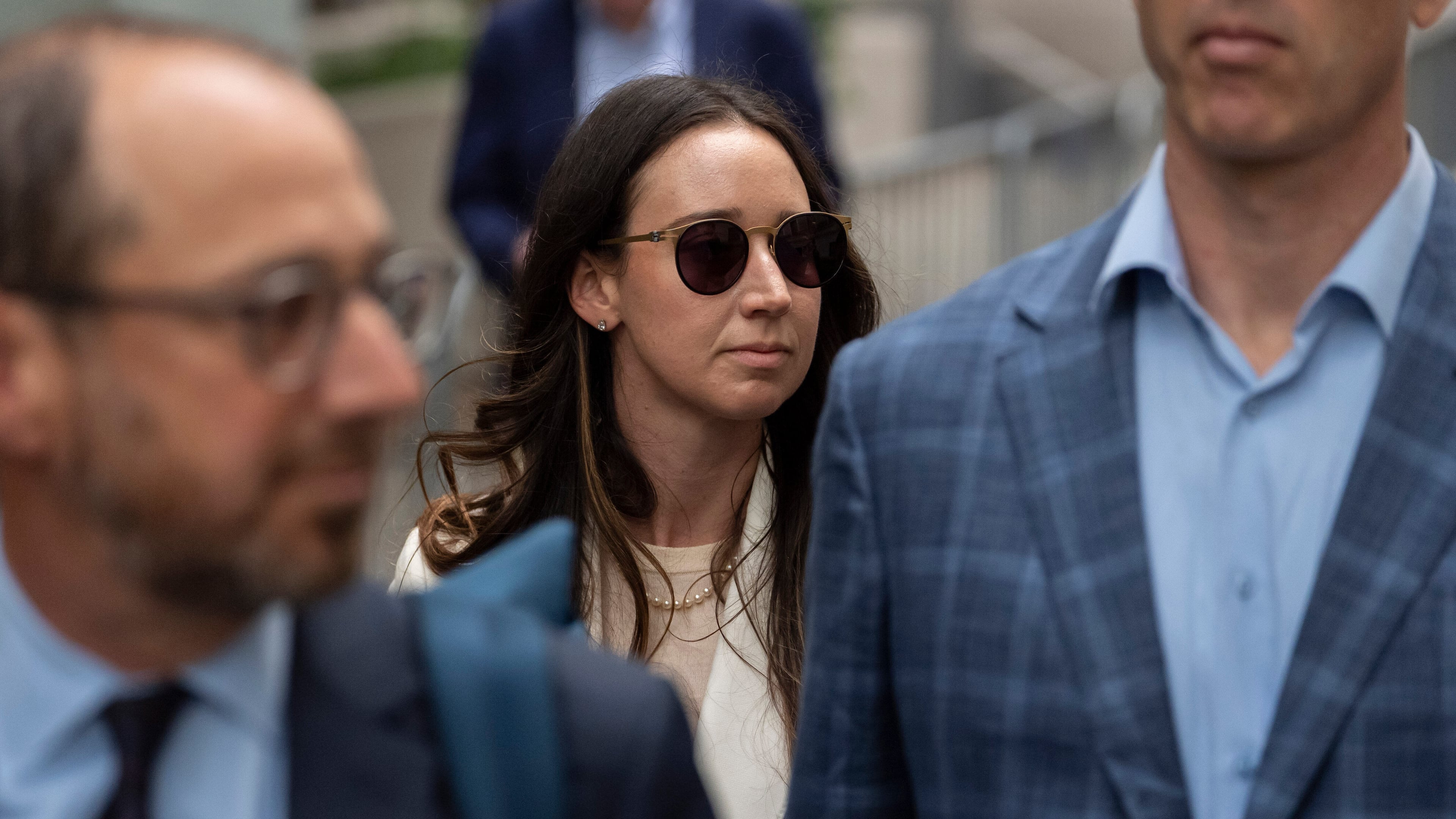 FILE - Charlie Javice, center, exits Manhattan federal court, Sept. 29, 2025, in New York. (AP Photo/Yuki Iwamura, File)
