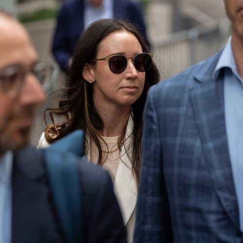 FILE - Charlie Javice, center, exits Manhattan federal court, Sept. 29, 2025, in New York. (AP Photo/Yuki Iwamura, File)