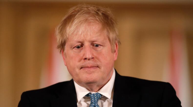 FILE - In this March 17, 2020 file photo British Prime Minister Boris Johnson gives a news conference about the ongoing situation with the COVID-19 coronavirus outbreak inside 10 Downing Street in London. (AP Photo/Matt Dunham, Pool)
