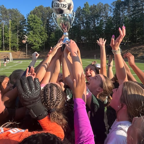 The Greenbrier Wolfpack celebrate their Class AAAAA girls’ soccer championship on Wednesday at Duluth High School, after beating Chamblee 3-0. (Jeff Gable/Access Atlanta)